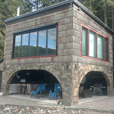 Lake Pend Orielle Bottle Bay Guest House by Sandpoint Builders inc., a custom luxury home builder in North Idaho.